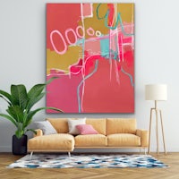 an abstract painting hangs above a couch in a living room